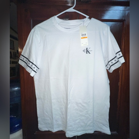 Men’s sz small Calvin Klein shirt navy trim on arms - Picture 1 of 2